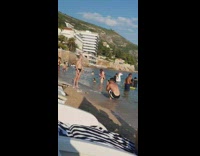 Bald guy black brief stand pose beach