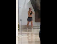 Collab IITW - Woman sports bra shadow boxing inside airport