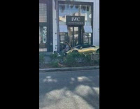 two men sit on gold chrome car