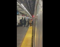 Man trying to push old piano in train