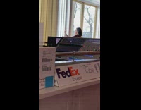 Woman takes selfie in front of window 