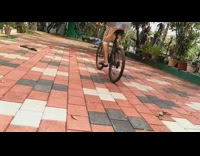 Grey shirt guy rides bicycle wheelie fail 