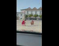 Woman red dress sit on chair street