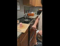 Guy pulls knife cuts slice of spam meat 