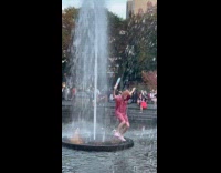 Random person dance at middle of fountain