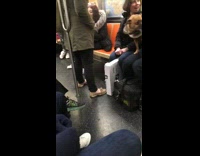 Inappropriate loudspeaker on subway dog black vest