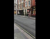 Red santa hat girl poses with balloons 