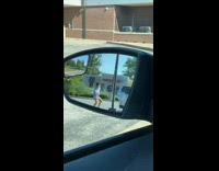 Woman tiktok dance side mirror parking lot