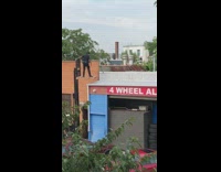 Forklift machine lifts cop up to rooftop 