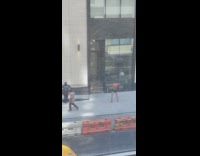 Shirtless guy does strange movements outside