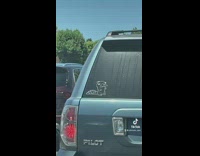 Platypus sticker on blue honda pilot 