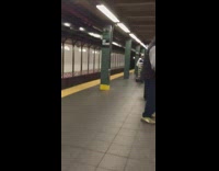 Guy sings song while waiting for train 
