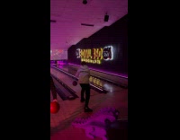 Teens play bowling throws many bowling balls 