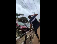 Guy tries to jump over railing falls on scooter 