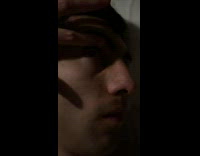 Woman lifting snoring boyfriends eyelid