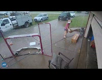 Girl cardboard box runs into garage door 