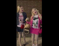 Two people dressed as White Chicks act out scene