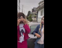 Guy in white chicks costume tries to fix wig 