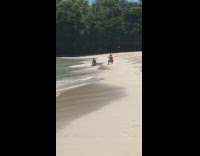 Red bikini beach photoshoot waves trees 