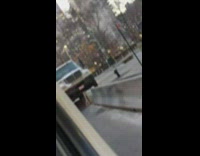 Truck stuck midair on sidewalk divide