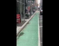 Guy exercises with resistance band around scaffolding 