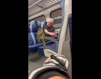 Man in train touch his bare feet