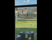 Guy films music video in play ground