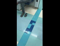 Lady takes foot out of brown sandal 