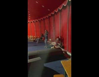 Group of boys play around the circus tent