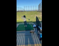 Kid Swings Golf Club and Hits Ball