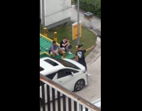 Man selfie with two men beside car