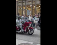 Guy sings to Party in the USA on motorcycle 