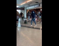 Collab IITW - Man white underwear out dances middle of airport