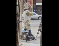 Guy sings karaoke with pizza and cereal box over his face