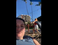 Woman red top dances behind the filmer
