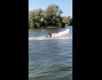 Guy jumps spins backflips red jet ski 