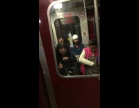 Condom stuck on window of red subway