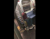 Headless Red Shirt Guy Rides Subway Someone Takes Picture of Him