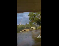 GIrl finds the end of a rainbow black suburban car 