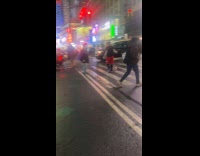 Man walks with ball at the street