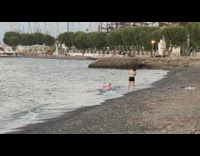 Guy white shorts lay side beach sunset