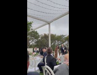 Groom throws cake groomsman catches in mouth