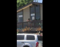 Lady dances exercises porch outside tablet class