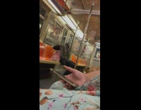 Woman scratches armpit under blanket subway
