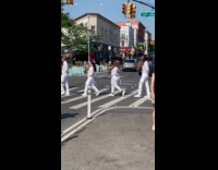 Group market campaign white outfit crossing street