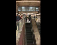 Guy walking up down escalator walks in place 