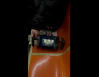 Man holds screen camera at subway seat
