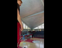 Guy kicks basketball from top of bleachers 