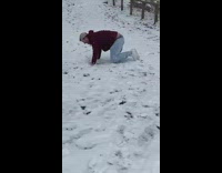 Man Slips as He Walks on Snowy Road