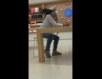 Guy in apple store dog on shoulder 